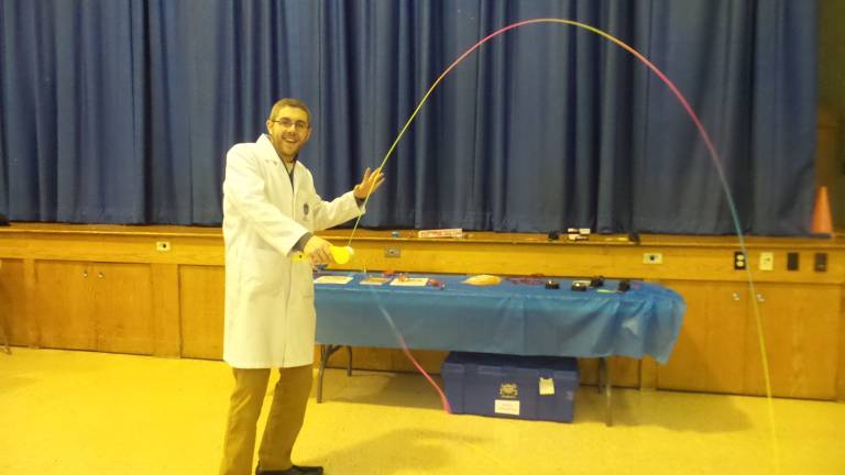 A fun night for science and math Will Rittenhouse, AKA Wacky Will, with string machine that adheres to the form of whatever it touches