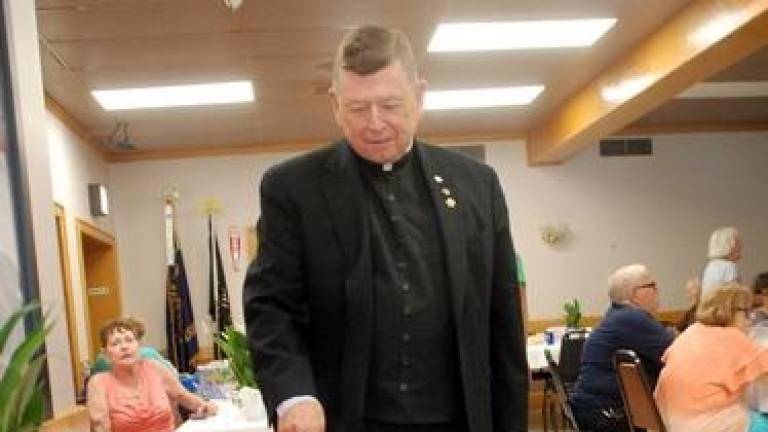 Three cheers, and cakes, for Father Bob upon his retirement Three cheers, and cakes, for Father Bob upon his retirement