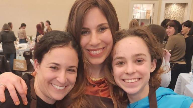 Mother and daughter Yasmine and Sivan Kalkstein of Monroe, together with Chana Burston, enjoy baking Challah together at the Chabad of Orange County’s Mega Challah Babka Bake.