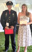 Goshen High School senior Preslei Bakker (r) was awarded the Chief John H. Egbertson Memorial Scholarship during the school’s Scholarship Banquet on June 12, 2025. The award was presented by School Resource Officer Brandon Raab on behalf of the Village of Goshen PBA.