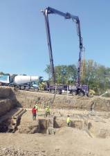 Cement is being poured for the foundation of the first house under construction at The Greens at Chester. Photos by Frances Ruth Harris.