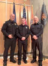 Orange Sheriff Paul Arteta, Corrections Academy graduate Dillon Dunham, and Town of Goshen Police Chief James Post.