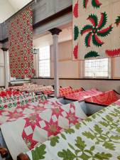 Enjoy an exhibit of dozens of 19th century quilts and coverlets at the Warwick Historical Society’s “Red, White and Green” antique quilt and coverlet show, artfully displayed in the Old School Baptist Meeting House, on Friday and Saturday, Nov. 26 and 27, from 12 to 4 p.m., and Sunday, Dec. 5, from 12 to 3 p.m. Provided photo.