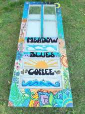 Artwork from local artist Desiree Rosalee Art can be seen displayed outside of Meadow Blues Coffee shop in Chester.