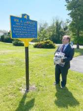 Tom Landrigan, Esq., of the law firm Cohen, LaBarbera &amp; Landrigan, unveils W.A. Lawrence historic marker in Chester. The firm occupies the former home of William A. Lawrence at 99 Brookside Avenue.