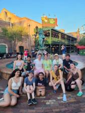 Goshen High School seniors under a Miss Piggy fountain in Hollywood Studios. Back row: Catherine Lienemann, Tanvir Signh, Gabe Kaufman, Madison Allan, Ash Kryou, Joseph Carmona. Front row: Aliana Vanichpong-Barbosa, Hannah Fruhling, Mia Colangelo, Michelle Gukhman, Lindsay Keane.