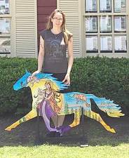 Paula Arwen Owen and her Painted Trotter outside the offices of Griffith Olivero Realtors.