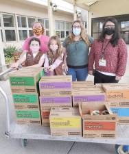 Thanks to a donation from William Kelly, girls scouts from Chester Troop 241 delivered more than 250 boxes of Girl Scout cookies to the residents of Valley View Nursing Home in Goshen. Photos provided by Nicole Mann.