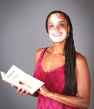 Chester resident Dayanara García with her debut book, “Faced With Vitiligo: An Anthology of Spoken Word Poetry.”