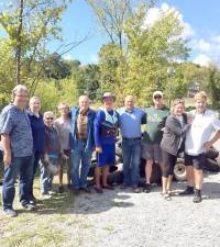 More than a score of helpers worked last weekend to remove nearly two tons of debris from Walton Lake. Pictured here area just some of the volunteers together with Chester Mayor John Thomas Bell and Town of Monroe Supervisor Tony Cardone. Photos provided by Ralph Pena and Andrew Lawrence and the Friends of Walton Lake.