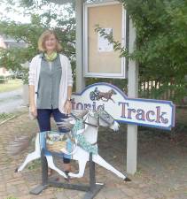 Pat MacDonald and her Painted Trotter at the entrance to Historic Track in Goshen.