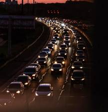 Photo illustration of highway traffic by Miguel Barrera via pexels.com.