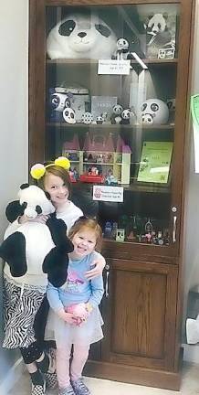 The inaugural monthly display of personal collections at the Goshen Public Library began this March with the display in the main lobby of “Peppa Pigs” and of “Pandas.” Meadow Meland, age four, loves the television series about Peppa Pigs and her world of characters. Her friend and cousin, eight-year old Mairead Hoens, loves Pandas — who doesn’t! Now that the library is open again, another collection of a child or an adult will be displayed. If you have a collection which you would like to share for one month, email Jim Tarvin at jtarvin@hvc.rr.com. Photo provided by Jim Tarvin.