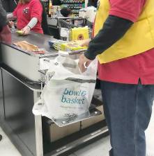 Bagging at ShopRite: using plastic bags like these will soon become a practice of the past.