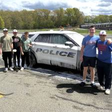 Goshen police officer and former Gladiator baseball player supports teams car wash fundraiser