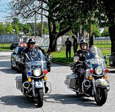 Goshen Village Police patrolling on motorcycles.