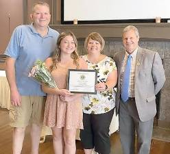 Pictured from left to right are Norm Miller, Maggie Miller, Kim Miller and Goshen Lions Club President Ken Tschan. Provided photo.