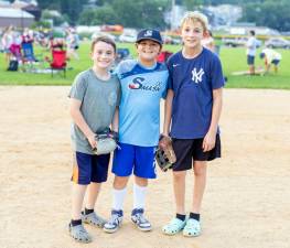 Jack, 9, Danny, 10, and Sean, 12, from Warwick play baseball as they await the Chester firework show. Photos by Sammie Finch.