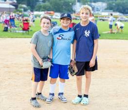 Jack, 9, Danny, 10, and Sean, 12, from Warwick play baseball as they await the Chester firework show. Photos by Sammie Finch.