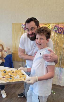 Families bake Hamantashin in preparation for Purim holiday
