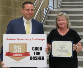 Susan Armistead (right) the founder of the $5 Generosity challenge with Orange County Executive Steve Neuhaus.