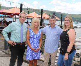 The Warwick Valley Chamber of Commerce Aug. 28 lakefront business mixer are, from left: Warwick Valley Chamber of Commerce Executive Director Michael Johndrow, Programs Director Janine Dethmers, Cove Castle Owner Bob Pereira and Chamber Office Manager Bea Arner.