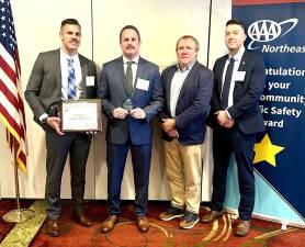 Pictured left to right: Village of Goshen Police Traffic Safety Officer Cody Hunt, Drug recognition expert, Officer Francis Winski, AAA Vice President of Public and Government Affairs John Corlett, Village of Goshen Police Sergeant David Yates.