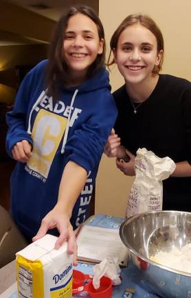 Sisters Haley and Jordan Resty get ready to bake pumpkin pies for seniors at Chabad of Orange County’s Thanksgiving CTeen Cook-Off.