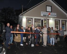 Noel Spencer alongside Orange County Chamber members at the ribbon cutting for Spencer’s Financial in Goshen. Photo provided.