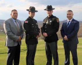 Orange County Undersheriff Wilfredo Garcia, Deputy Joseph April, Deputy Frank Conklin and Sergeant Jeremy Yela. April and Conklin were honored with Meritorius Service Awards