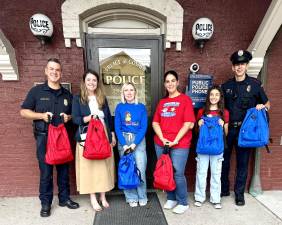 Chief Ryan Rich, Mayor Molly O’Donnell, Heather Rafferty Savatta, Sandra Diaz, Daniella Diaz, and Patrolman Darren Swenson.