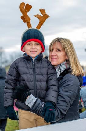Anthony and Andrea Barret wait for Santa to arrive in Monroe.