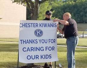 Jim Fries, head of Buildings and Grounds, and Brett Sutton, attached this thank you sign to essential school workers organized by the Chester Kiwanis Club. The signs are located at Chester Academy and Chester Elementary School. Photo provided by Sue Bahren.
