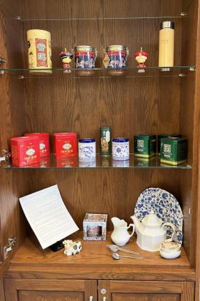 The collection of Tea Boxes currently on display in the lobby of the Goshen Public Library and Historical Society.