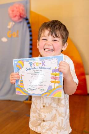 Jackson Schmitt, 4, after receiving his moving up certificate. Photos by Sammie Finch.