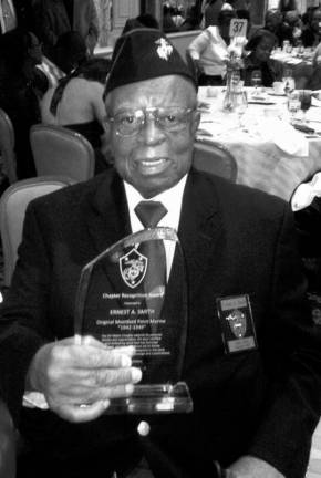 Ernest Smith holding a Chapter Recognition Award he received last year for being one of the original Montford Point Marines.