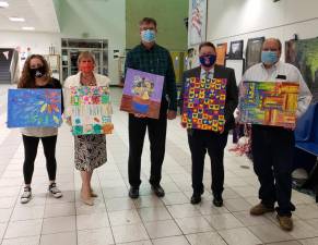 Chester Board of Education members were recently presented with artwork created by CES students. Pictured from left to right are: Dawn Guevara, Vice President Sandy Nagler, Keith Brideweser, President Frank Sambets and John Pasichnyk. Photos provided by the Chester School District.