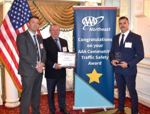 <b>Village of Goshen Police Sergeant David Yates, AAA Vice President of Public &amp; Government Affairs John A. Corlett, and Village of Goshen Police Officer Cody Hunt.</b>