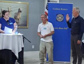 Ron Klieverik is sworn in as president of the Rotary Club of Goshen by District 7210 Governor Carrie Hernandez of the Brewster Club.