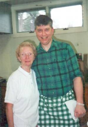 Church Elder Jerry Sutherland with his mom, Betty Lutjens, roast beef dinner at the First Presbyterian Church in 2000.