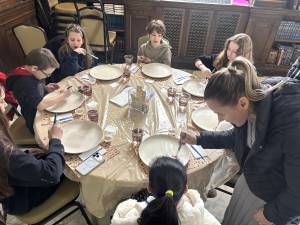 Children enjoy painting matzah plates at Chabad Goshen