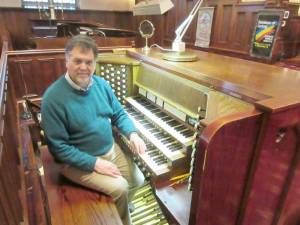 Jonathan Hall at the console of the organ at the First Presbyterian Church in Goshen.