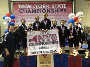 Kennett School of Gymnastics Xcel Bronze team, a division for ages 6 - 8, took first place at the New York State Championship in Syracuse on April 3. Photo provided.