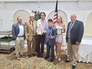 Pictured, from left, Lacrosse Coach Jarrad Vrydaghs, Interim Athletic Director Lou Cioffi, Jacob Kriney, Nathan Dershem, Kayla Schramm and Ski Coach Tom Gilbert.