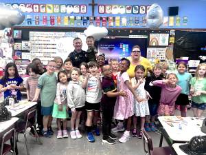 Village of Goshen Police Sgt. Robert Kozlowski and the first graders at St. Johns Elementary School during Career Day on June 18, 2025.