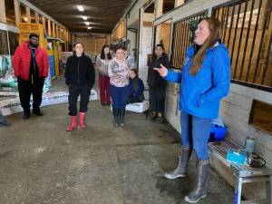 Veterinarian Megan Knoell speaks to Orange-Ulster BOCES students about caring for farm animals at Banbury Cross Farm in Goshen.