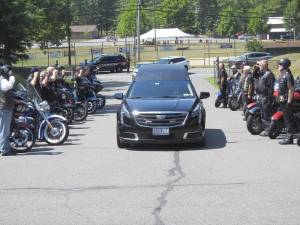 Veteran Alex Gamma, who died at 80 on July 12, is saluted at his funeral by 21 veteran motorcyclists.