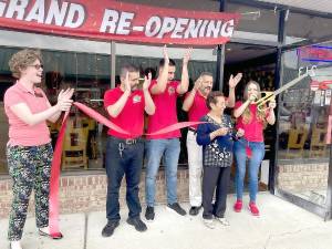 From left, Warwick Valley Chamber of Commerce Board President Elizabeth Cassidy joins Mr. Dog Owner Ruben Godinez and Team Manager Manuela Longas alongside staff for their grand re-opening and ribbon-cutting ceremony. Photo by Olivia DiCostanzo.