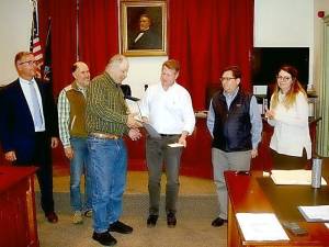 Retiree Dan Slesinski accepted a Certificate of Gratitude from Village Mayor Scott Wohl. Looking on are (l to r)Trustees Chris Gurda, Tony Scotto, Jonathan Rouis, and Molly O’Donnell.