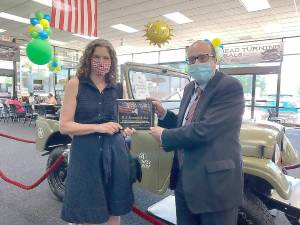 State Sen. Jen Metzger presents Joseph Suresky with a New York State Senate Empire Award. Provided photo.